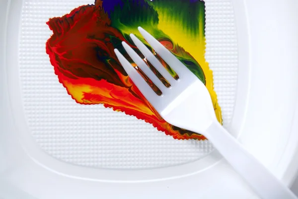 Paint colorful mix with a plastic fork — Stock Photo, Image