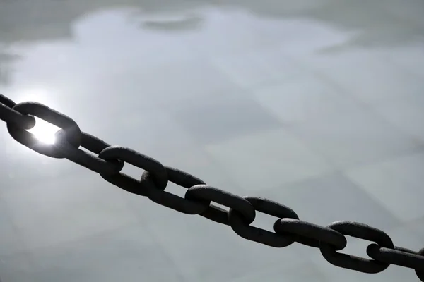 Chain outdoor with water tiles and reflexion — Stock Photo, Image