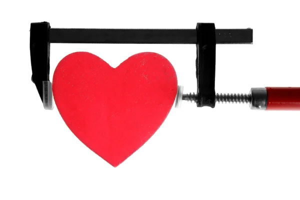 Klemmgriff-Werkzeug drückt rotes Herz — Stockfoto
