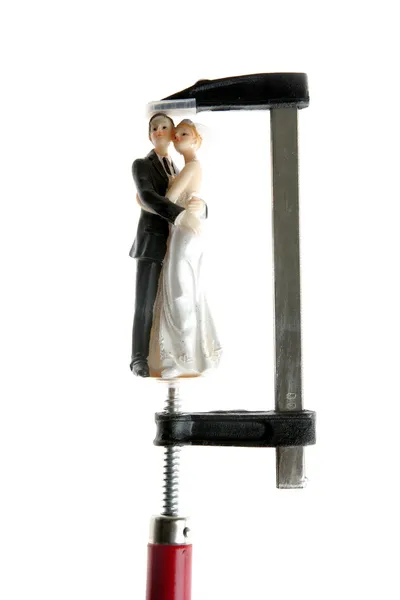 Wedding figurine under pressure — Stock Photo, Image