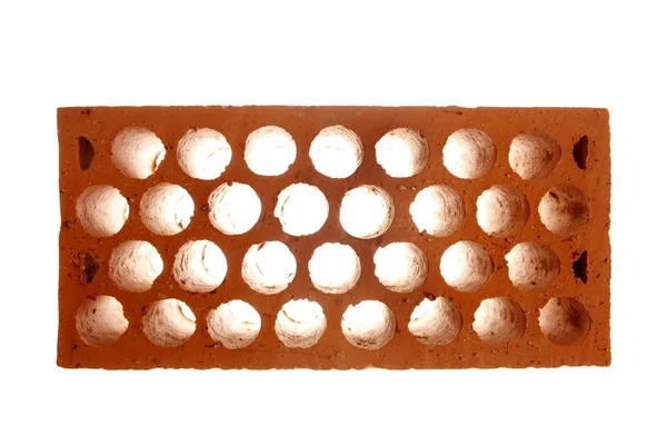 Brick with honeycomb, construction metaphor — Stock Photo, Image