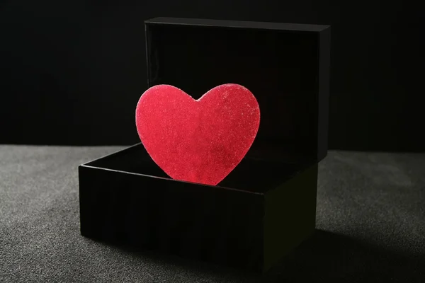Caramelle focolare in una scatola nera — Foto Stock