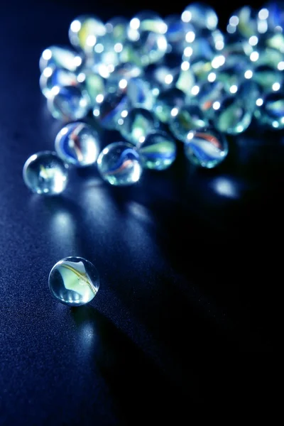 Glass marbles with blue reflections — Stock Photo, Image