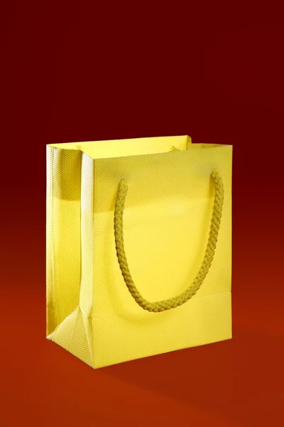 Shopping bag over red background — Stock Photo, Image