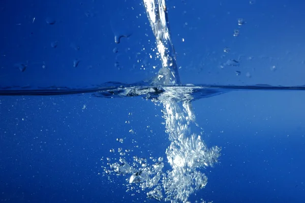 Blue water falling like splash — Stock Photo, Image