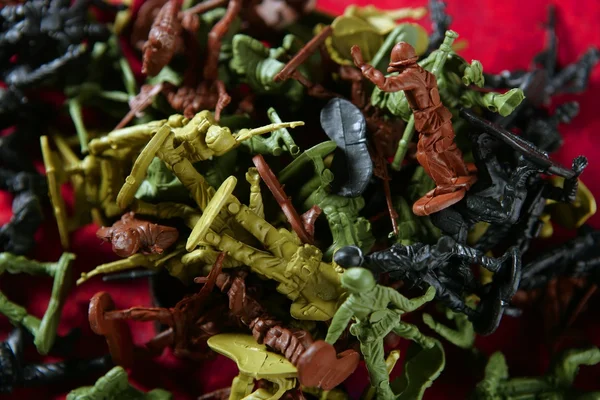 Metaphor of dead plastic toy war soldiers — Stock Photo, Image