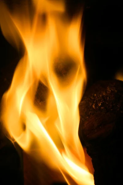 Orange fire over black background — Stock Photo, Image