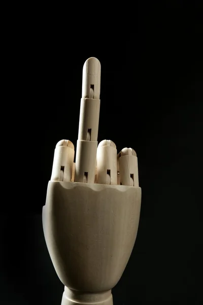 Piszkos kifejezés középső ujját fel, fa manöken kéz — Stock Fotó
