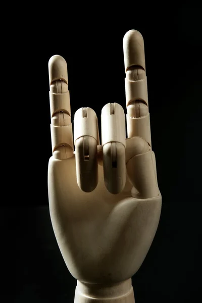 Mannequin wooden hand, horns with fingers — Stock Photo, Image