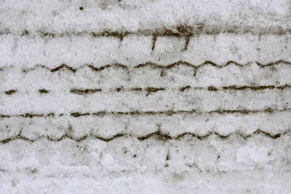 Sneeuw macro detail van auto weel voetafdruk — Stockfoto