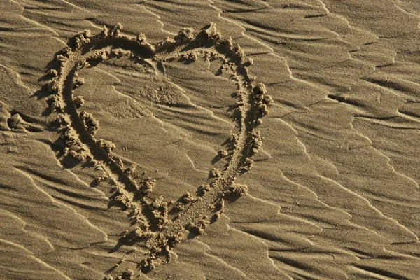 Terra disegnare sulla superficie di sabbia spiaggia — Foto Stock