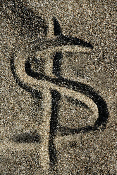 stock image American currency dollar sign on the beach sand