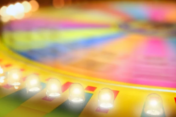 Roulette de jeu luisante colorée floue — Photo