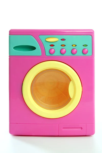 Színes rózsaszín sárga ruhák játék mosógép — Stock Fotó