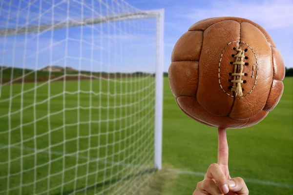 Football ball in hand net soccer goal — Stock Photo, Image