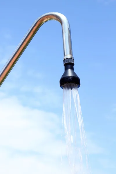 Shower sprinkler on blue sky outdoor water falling — Stock Photo, Image