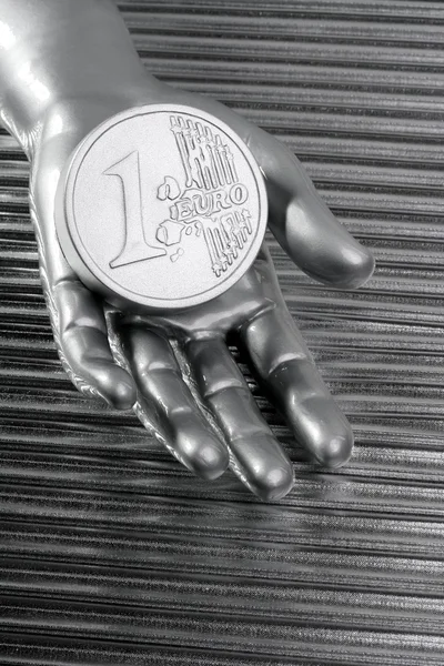 Euro silver coin of futuristic metallic silver hand — Stock Photo, Image