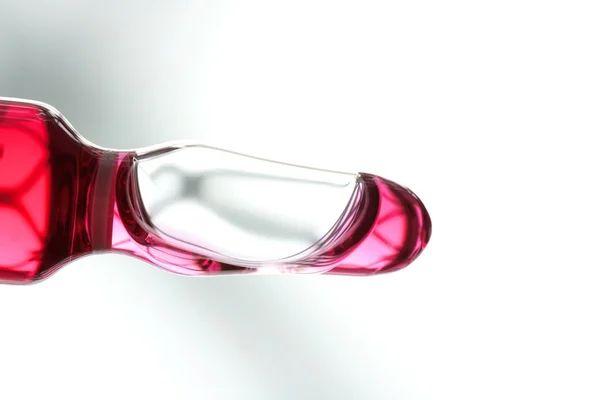 Ampolla de vidrio con medicina líquida roja —  Fotos de Stock