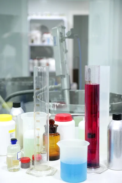 Laboratory stuff, glass cylinder, colorful liquids — Stock Photo, Image