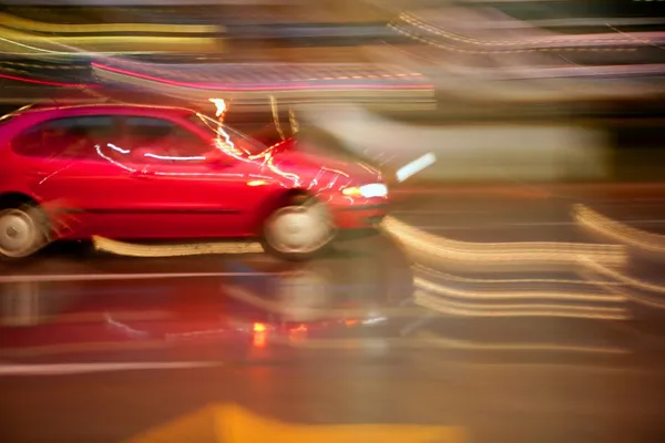 Car moving in rainy night motion blur — Stock Photo, Image
