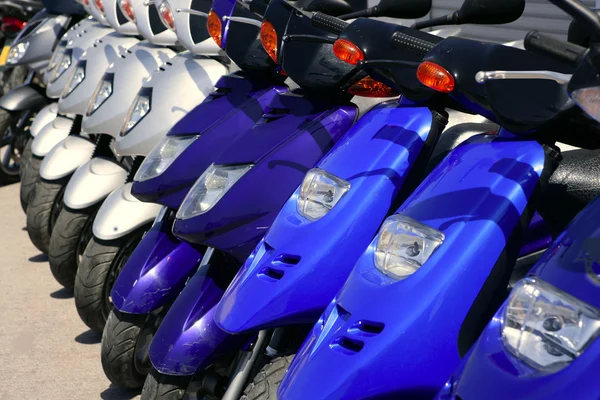 Scooter motorbikes in a row with perspective — Stock Photo, Image