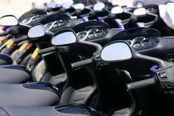Scooter motorbikes in a row with perspective — Stock Photo, Image