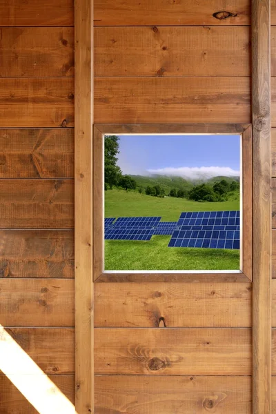 Janela de madeira placas solares vista prado — Fotografia de Stock