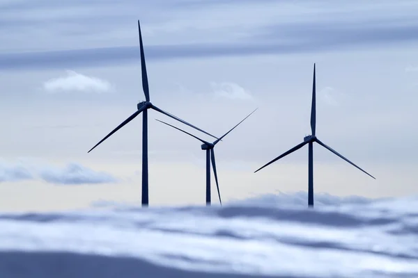 Aerogenerator electric windmills snow mountain — Stock Photo, Image