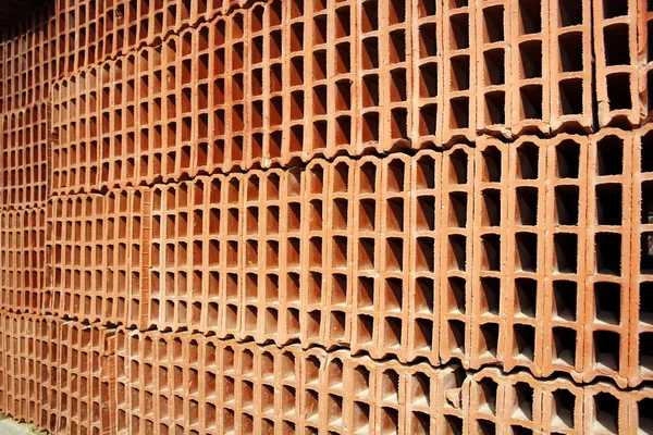 Κατασκευή τούβλων στοιβάζονται μοτίβο κόκκινο πηλό — Φωτογραφία Αρχείου