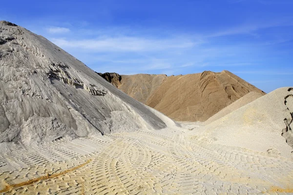 Sand quarry mounds of varied sands color — Stock Photo, Image