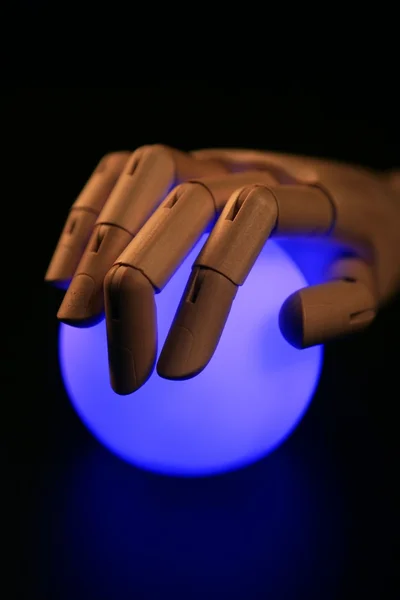 Wooden mannequin hand, ball of light, fortune teller — Stock Photo, Image
