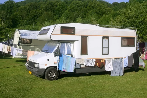 Caravan van in the green meadow camping — Stock Photo, Image