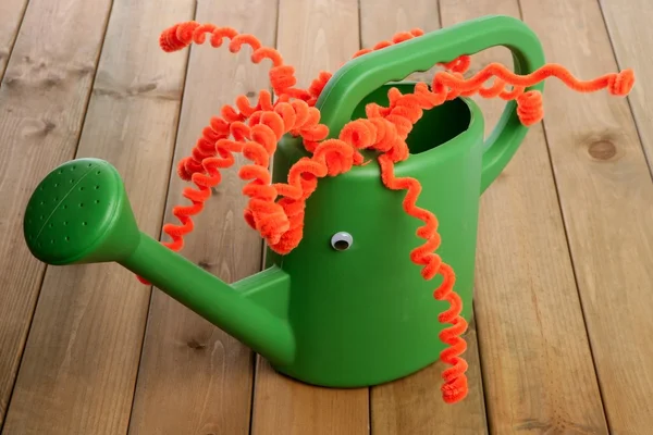 Handmade garden can toy funny face — Stock Photo, Image