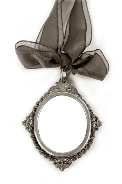 Medallón de plata Cameo con cinta de lazo copyspace —  Fotos de Stock