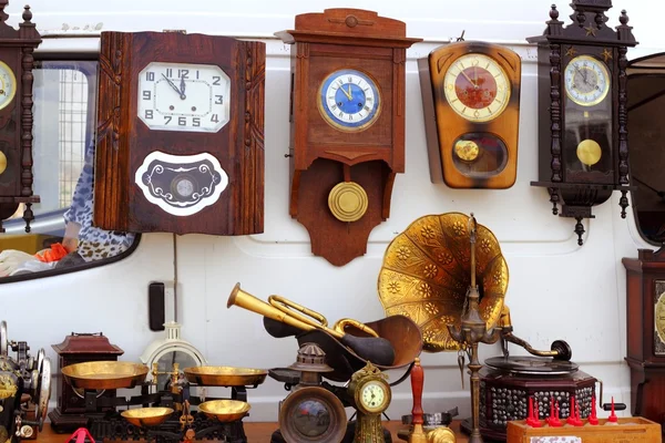 Antiques fair market wall old clocks — Stock Photo, Image