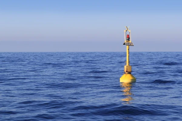 Floating yellow beacon blue sea ocean — Stock Photo, Image