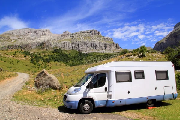 Camper van in mountains blue sky — Stock Photo, Image
