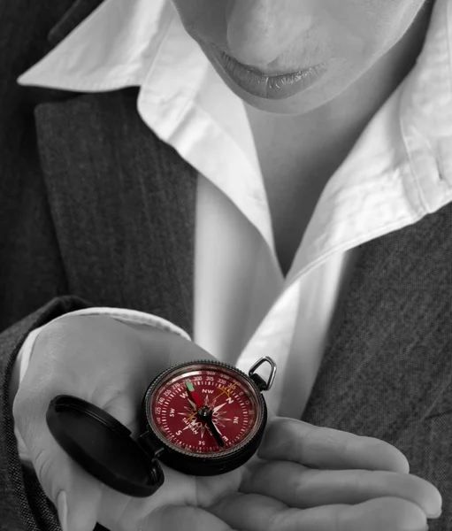 Business woman with compass in her hand — Stock Photo, Image
