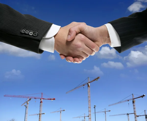 Businessmn handshake in construction area — Stock Photo, Image