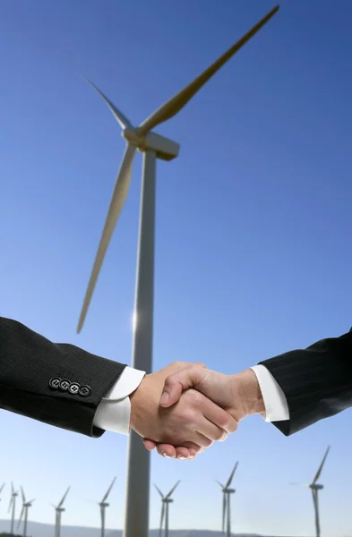 stock image Businessmen environmental wind mill handshake