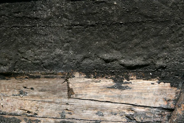 Black paint in wooden boat hull grunge aged — Stock Photo, Image