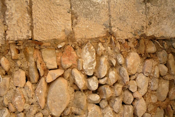Muro de piedra de mampostería dorada del edificio antiguo —  Fotos de Stock