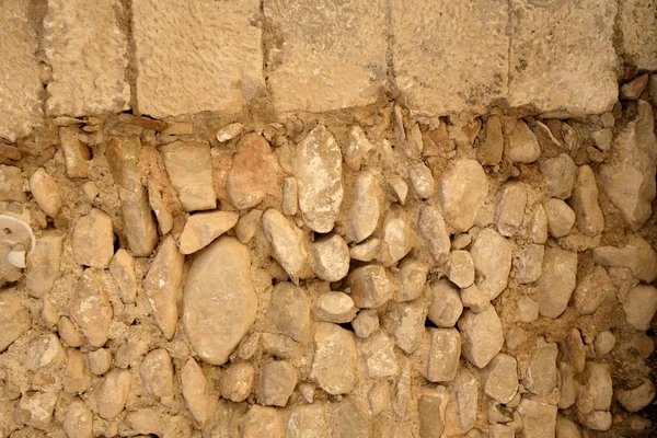 Kamienny mur złoty murarskie od starego budynku — Zdjęcie stockowe