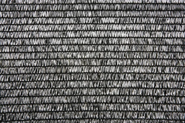 Tessuto grigio rafia texture plastica modello di sfondo — Foto Stock