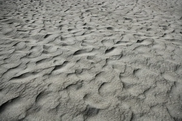 Stranden sand vågor värma textur bakgrund — Stockfoto
