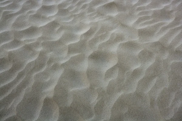 Spiaggia sabbia onde calda texture sfondo — Foto Stock