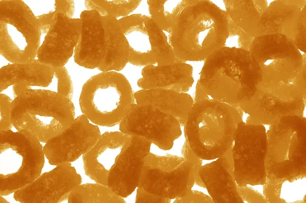 Round snacks food fried corn rings background — Stock Photo, Image