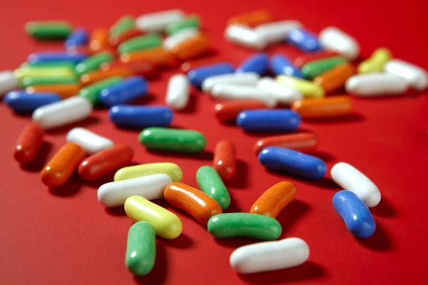 カラフルな錠剤のお菓子キャンディー バック グラウンド パターン — ストック写真