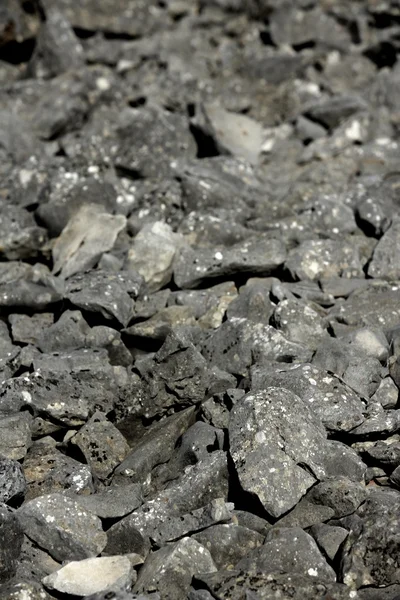 Piedras grises oscuras textura áspera — Foto de Stock