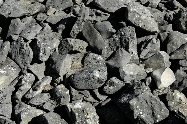 Pedras cinzentas escuras textura áspera — Fotografia de Stock